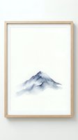 Minimalist watercolor mountain peak in soft blue tones framed in natural wood frame on white wall for modern home decor and interior design projects.