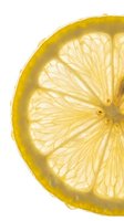 Sliced lemon half with vibrant yellow skin and translucent flesh segments isolated on white background, suitable for food, beverage, culinary, and design projects.