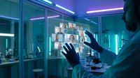 Professional businessman touching holographic video conference display with multiple participants in futuristic office environment with neon lighting.