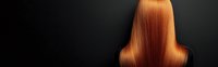 Luxurious straight copper red hair from behind on dark background, showcasing smooth texture and shine for beauty salon or hair care advertising.