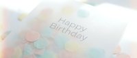 Elegant Happy Birthday greeting card surrounded by soft pastel confetti dots, creating a festive and delicate celebration atmosphere.