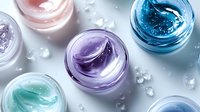 Colorful moisturizing face creams in glass jars on gray background with water drops. Luxury skincare and beauty cosmetics concept for spa treatment.