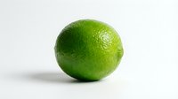 Fresh green lime with textured skin isolated on white background, suitable for food, beverage, nutrition, and culinary content.