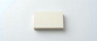 Blank cream business card mockup on white background for branding and corporate identity design projects.