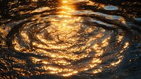 Golden sunlight reflects on rippling water surface creating spiral pattern with glowing waves and circular motion effect at sunset. Suitable for nature backgrounds.