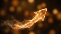 Golden glowing arrow pointing upward with sparkling particles and light effects on dark background symbolizing growth, success and progress.