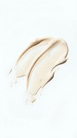 Creamy beige foundation or concealer smear isolated on white background for cosmetic and makeup product advertising campaigns.