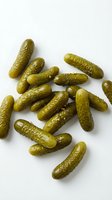 Fresh dill pickles isolated on white background, ready for food and culinary design projects, packaging, menus, and recipe illustrations.