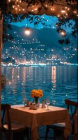 Romantic waterfront dining table with orange roses and string lights overlooking illuminated coastal cityscape at twilight, reflecting on calm water surface.