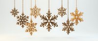 Elegant wooden snowflake ornaments hanging on chains against white background. Winter holiday decorations for Christmas crafts and seasonal design projects.