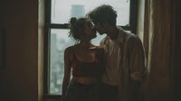 Young diverse couple sharing intimate moment by window in rustic interior with natural lighting for romantic lifestyle photography and relationship concepts.