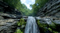 Cascading waterfall flows between moss-covered rock formations in dense forest setting, creating dramatic perspective with natural stone textures and flowing water.