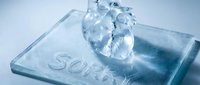 Glass heart on a transparent plate with the word Sorry, symbolizing apology, heartbreak, and emotional vulnerability in relationships.