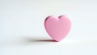 Pink heart shape object on white background isolated for romantic design projects and Valentine's Day decorations.
