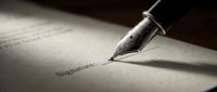 Fountain pen writing on document with signature, suitable for business, legal, and contract concepts.
