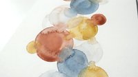 Abstract watercolor circles in blue yellow orange overlapping on white paper creating modern artistic composition for contemporary interior design.