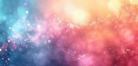 Dreamy abstract background with blurred bokeh lights in coral pink, turquoise blue and golden colors perfect for romantic or magical design projects and festive celebrations.