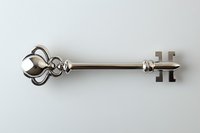 Ornate silver vintage key with decorative bow and elaborate ward pattern isolated on white background, suitable for design projects and digital compositions.