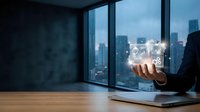 Businessman holding glowing digital interface with analytics charts and gear icons, city skyline background, technology and business concept.
