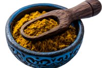 Ground turmeric powder in decorative blue ceramic bowl with wooden scoop, bright yellow spice on white background, isolated for culinary and wellness designs.