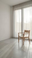 Minimalist interior with wooden chair and sheer curtains in bright modern room with concrete floor and natural light for contemporary home design.