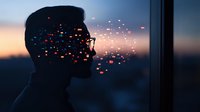 Male silhouette profile against sunset sky with glowing particles dispersing from mouth, creating magical atmospheric effect for conceptual designs.