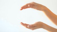 Female hands with light skin tone positioned in cupping gesture against white background, conveying care, protection, support, or holding concept for healthcare, wellness, and safety messaging.