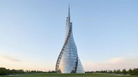 Futuristic spiral glass tower with reflective facade against clear sky and green landscape surroundings, suitable for architecture and corporate design projects.
