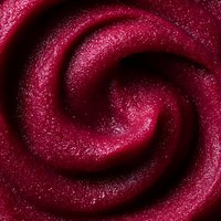 Mesmerizing burgundy spiral pattern with glittery texture creates abstract swirling motion effect against dark background, suitable for luxury cosmetic marketing designs.
