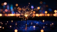 Glowing sparkler reflecting in water against blurred bokeh lights creating magical festive atmosphere during celebration at night.