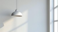 White pendant lamp hanging against minimalist light gray wall with soft natural window light creating subtle shadow patterns, modern interior design element.