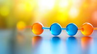 Vibrant orange and blue glass beads arranged in line on reflective surface with soft bokeh background creating modern minimalist composition with warm glow effect.