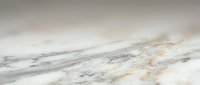 Elegant marble surface with soft gray and gold veining patterns creating luxurious natural stone texture for premium interior design and architectural projects.