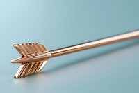 Metallic rose gold arrow on soft blue background with selective focus and minimalist composition, modern luxury design element for jewelry and accessories.