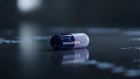 Futuristic pharmaceutical capsule with innovations text on reflective surface in modern medical laboratory setting for healthcare technology concepts.