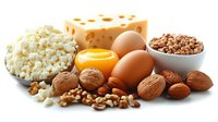 Fresh protein-rich foods including cottage cheese, eggs, walnuts, almonds and swiss cheese arranged on white background, healthy eating concept.