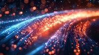 Abstract glowing particles flowing in curved lines with orange and blue light trails against dark background, creating dynamic motion effect and bokeh elements.