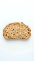 Sliced whole grain bread loaf half showing airy crumb structure and golden crust on white background for bakery and food styling use.