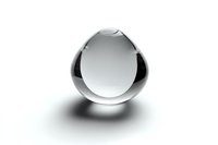 Clear glass sphere with soft shadow on white background, minimalist design element for luxury branding and modern compositions.