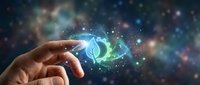 Hand reaching toward glowing energy orb with swirling particles against cosmic starry background for technology and innovation concepts.