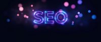 Glowing neon SEO letters with colorful bokeh lights on dark background for digital marketing and search engine optimization concepts.