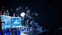 Modern laboratory with glowing blue digital interface, scientific equipment and colorful chemical solutions on dark background with bokeh lights.
