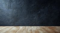 Empty wooden table against dark textured wall with dramatic lighting, creating moody atmosphere for product display or food photography staging.