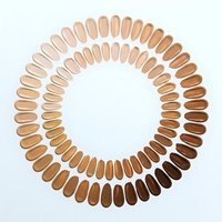 Foundation makeup color palette arranged in circular pattern showing diverse skin tone shades from light to dark on white background for cosmetic matching.