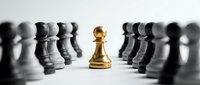 Golden chess pawn standing out among black pawns on white background symbolizing leadership, uniqueness and strategic thinking in business concepts.