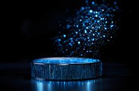 Magical blue glowing particles rising from cylindrical platform with metallic texture against dark background, creating ethereal atmosphere for product display.