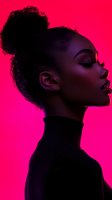 Profile silhouette of African American woman with curly hair bun against vibrant pink background, wearing black turtleneck in dramatic lighting.