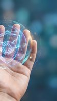 Human hand holding glowing holographic handshake symbol representing digital partnership, business collaboration and futuristic technology connections.