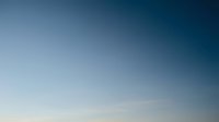 Clear blue sky gradient background transitioning from light to deep blue, cloudless atmosphere for weather forecasting and meteorology applications.