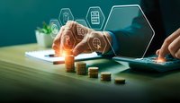 Digital finance technology concept with hexagonal icons floating above laptop and golden coins on wooden desk representing modern banking solutions.
